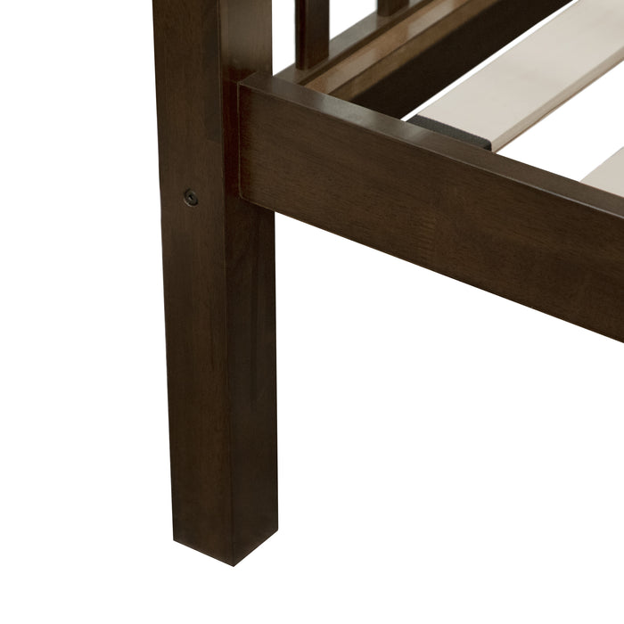 Left facing close up of the leg of a Mission style twin-over-full merlot wood bunk bed on a white background