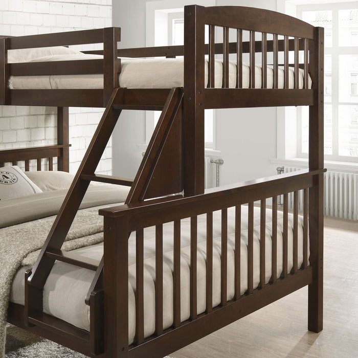 Left facing close up of the ladder and footboards of a Mission style twin-over-full merlot wood bunk bed in a room with linens