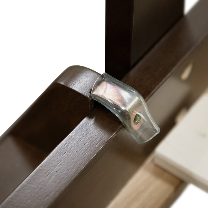 Left facing close up of the ladder attachment of a Mission style twin-over-full merlot wood bunk bed on a white background