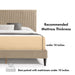 Informational close up image of a modern light brown corduroy channel tufted headboard queen platform bed showing mattress thickness, on a white background