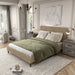 Left facing modern light brown corduroy channel tufted headboard queen platform bed in a room with linens and accessories