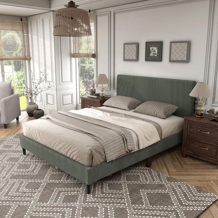 Left facing modern green corduroy channel tufted headboard queen platform bed in a room with linens and accessories