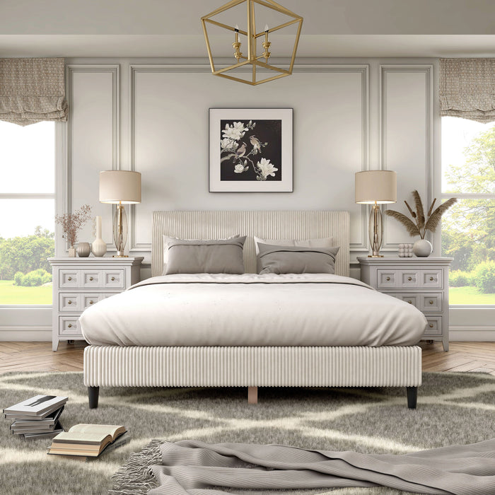 Front facing modern ivory corduroy channel tufted headboard queen platform bed in a room with linens and accessories