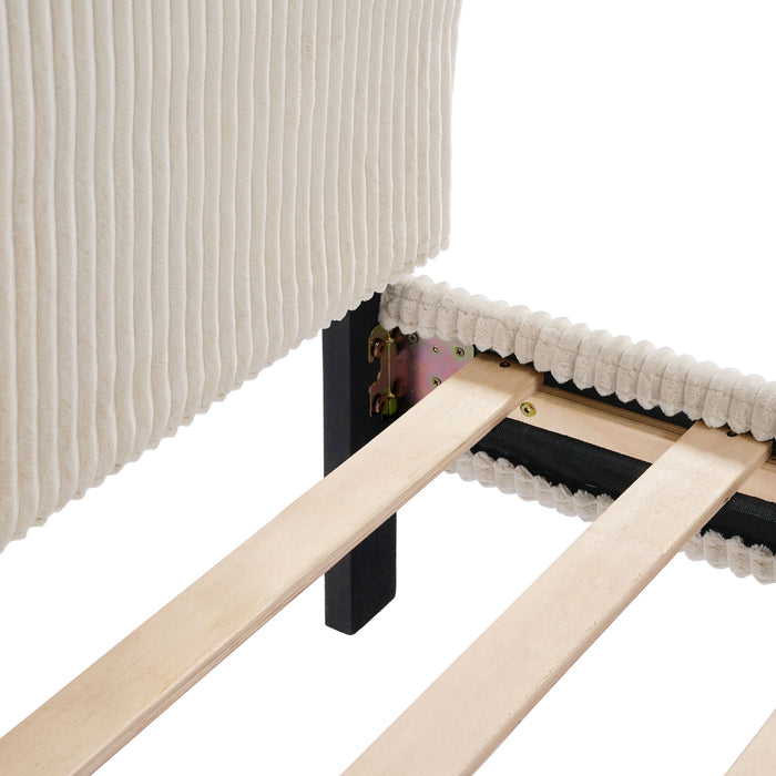 Right facing close up view of the headboard corner and slats of a modern ivory corduroy channel tufted headboard queen platform bed on a white background