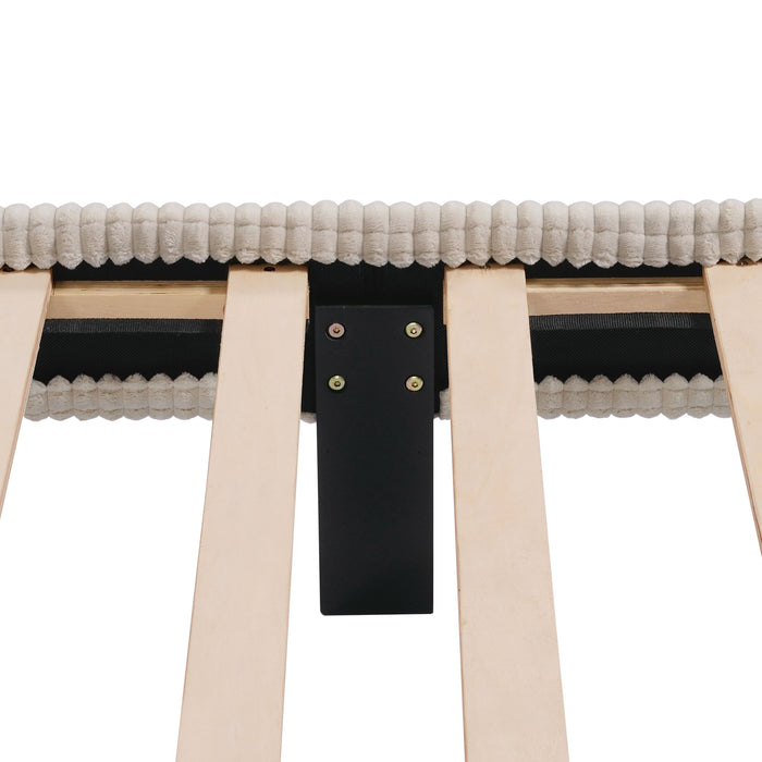 Front facing close up view of the interior support leg of a modern ivory corduroy channel tufted headboard queen platform bed on a white background