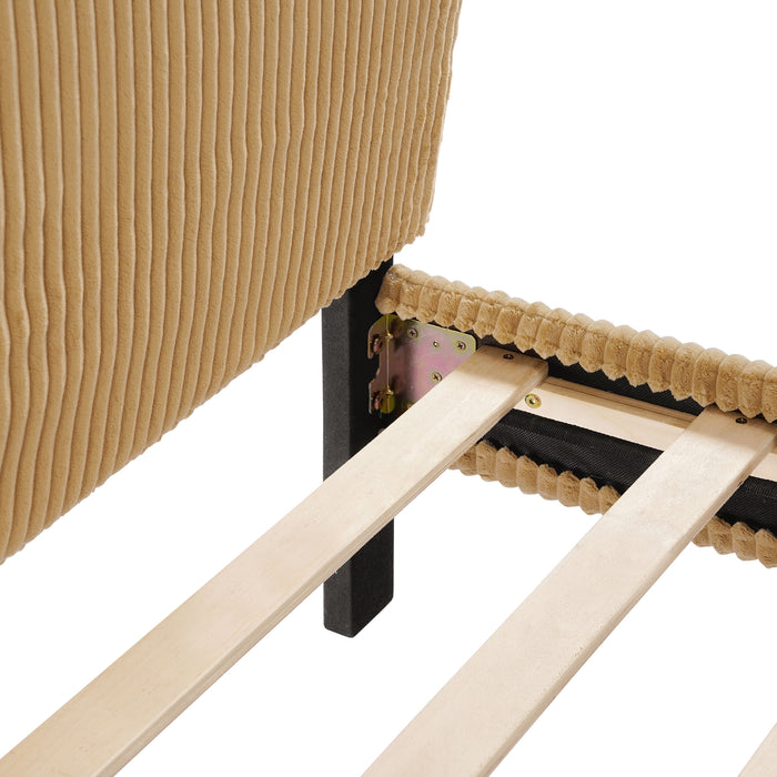 Right facing close up view of the headboard corner and slats of a modern yellow corduroy channel tufted headboard queen platform bed on a white background