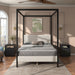 Front facing modern black finish queen canopy platform bed with white boucle upholstery in a room with linens and accessories