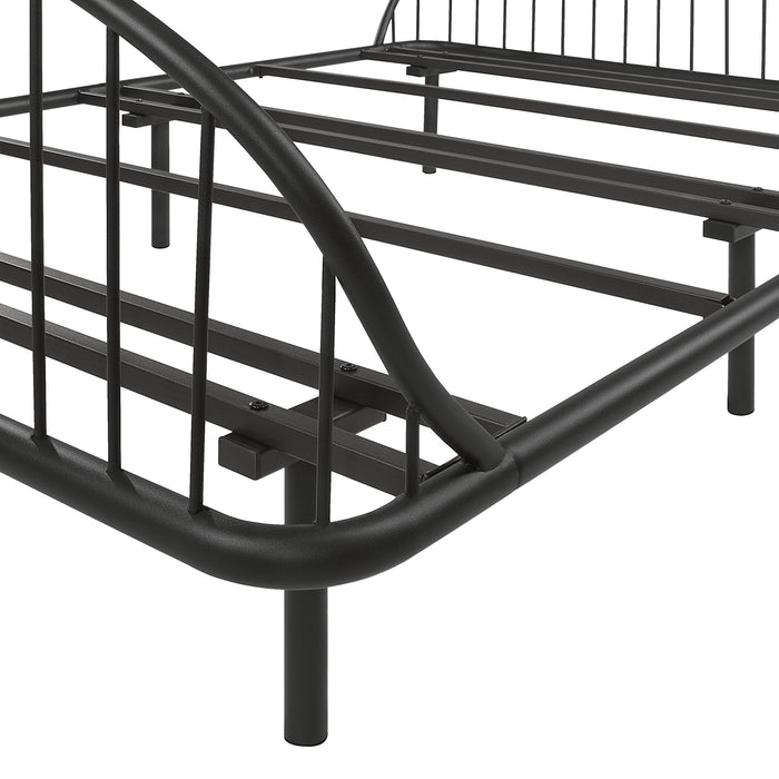 Left facing close up view of an industrial black metal full bed frame with rounded head and footboards on a white background