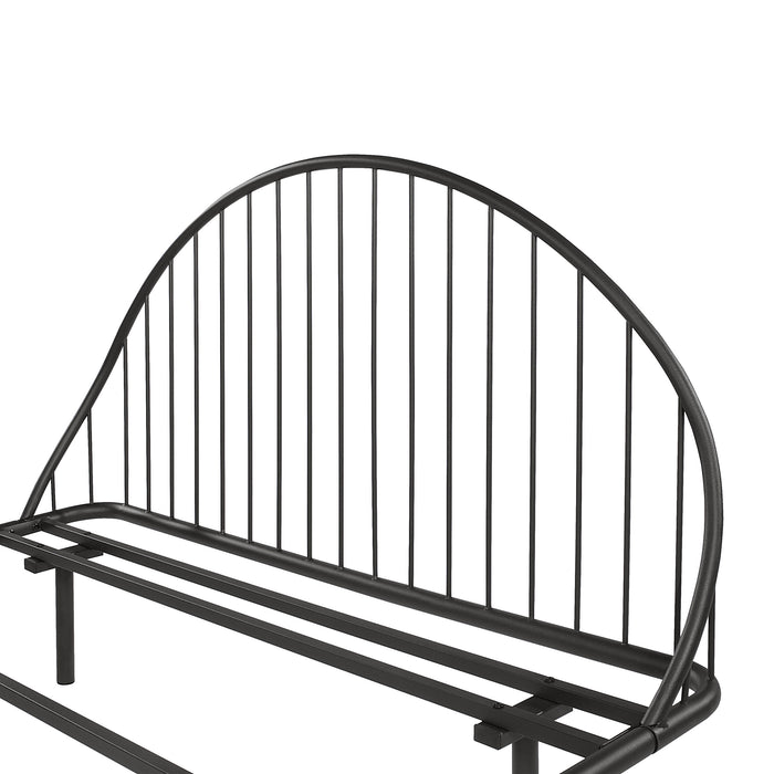 Left facing close up view of the headboard on an industrial black metal full bed frame with rounded head and footboards on a white background