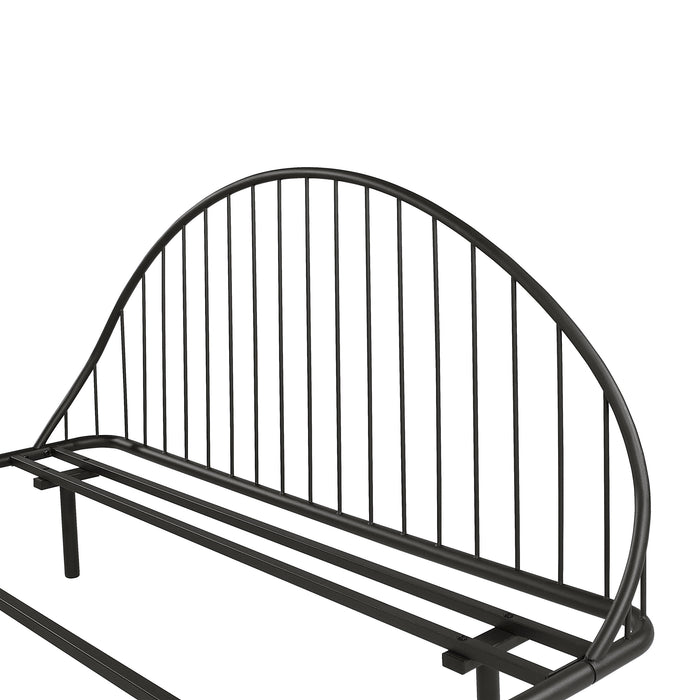 Left facing close up view of the headboard on an industrial black metal queen bed frame with rounded head and footboards on a white background