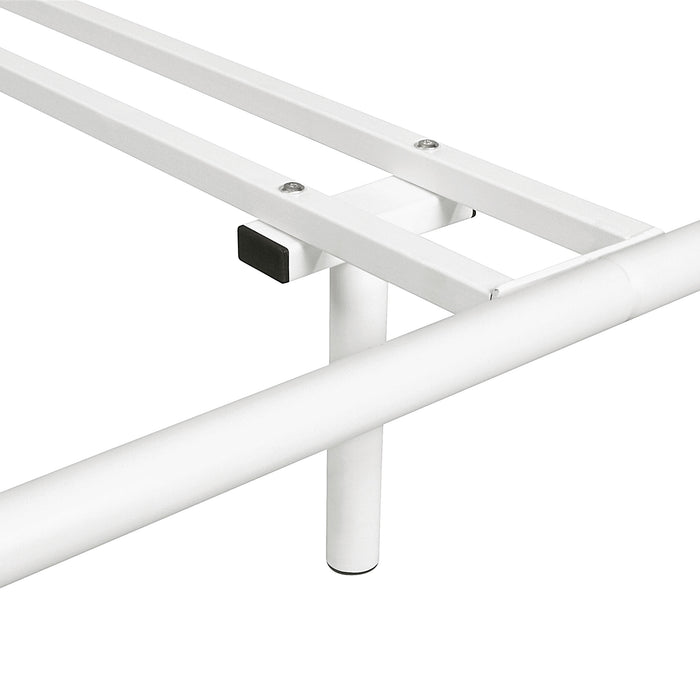 Left facing close up view of a T-support on an industrial white metal queen bed frame with rounded head and footboards on a white background