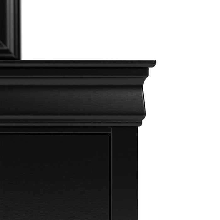 Front facing close up of a traditional black finish solid wood six-drawer dresser with a framed mirror showing its molded trim, on a white background