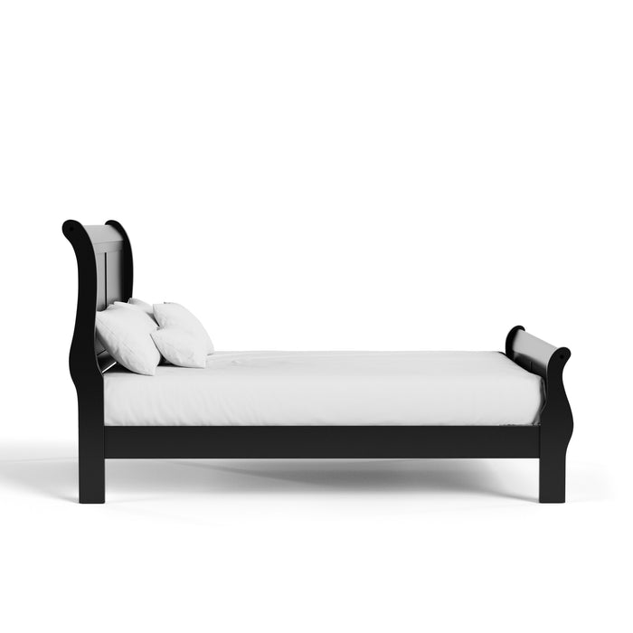 Front facing side view of a traditional black finish solid wood king sleigh bed with linens on a white background