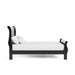 Front facing side view of a traditional black finish solid wood full sleigh bed with linens on a white background