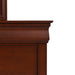 Front facing close up of a traditional cherry finish solid wood six-drawer dresser with a framed mirror showing its molded trim, on a white background