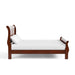 Front facing traditional cherry finish solid wood king bed with linens on a white background