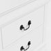 Right facing close up of a traditional white finish solid wood two-drawer nightstand showing its hanging drawer pull design