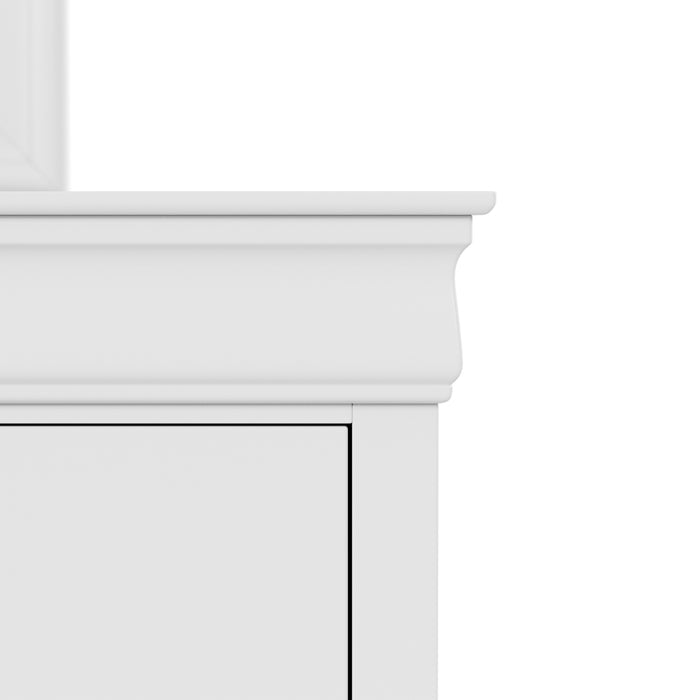 Front facing close up of a traditional white finish solid wood six-drawer dresser with a framed mirror showing its molded trim, on a white background