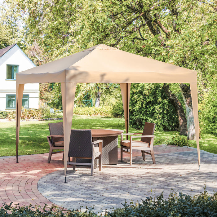 Right facing modern beige portable camping gazebo canopy with roof and anchors on a patio with accessories