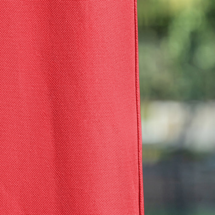 Close up view of the fabric of a modern red portable camping gazebo canopy with roof and anchors