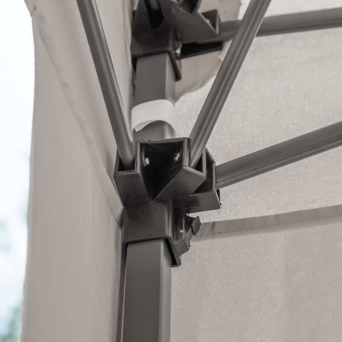 Close up view of the frame of a modern white portable camping gazebo canopy with roof and anchors