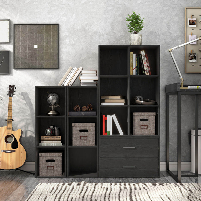 Front facing durable modern three-shelf slim black storage bookcase in a larger modular configuration in a room with accessories