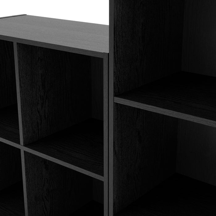 Left facing close up view of a durable modern four-shelf black storage bookcase on a white background