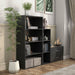 Right facing durable modern four-shelf black storage bookcase in a larger modular configuration in a room with accessories