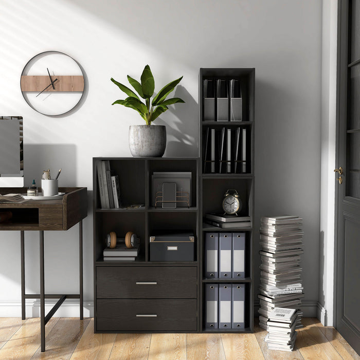 Front facing durable modern four-cubby black storage bookcase as part of a larger modular configuration in a room with accessories