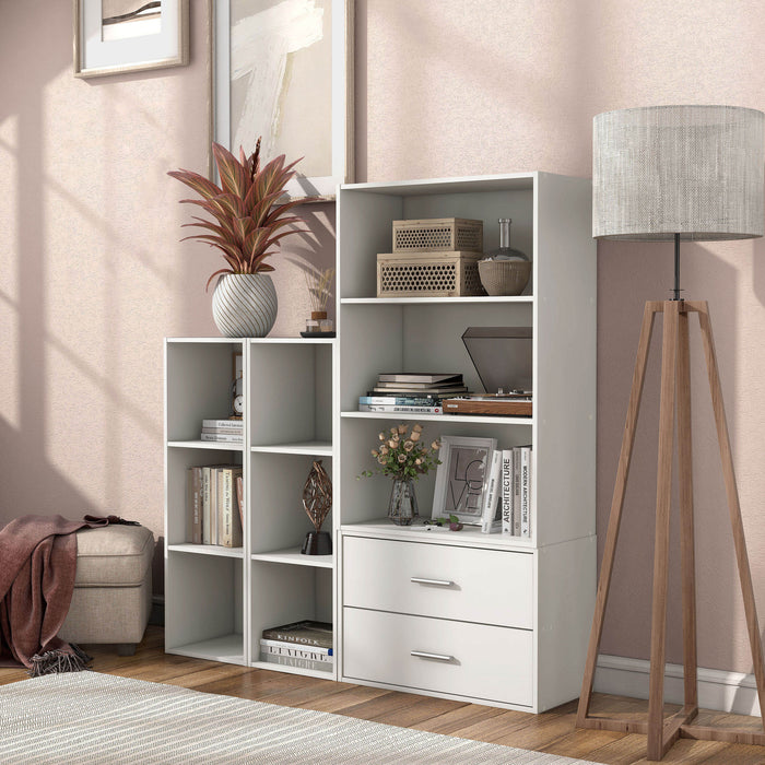 Left facing durable modern three-shelf slim white storage bookcase in a larger modular configuration in a room with accessories