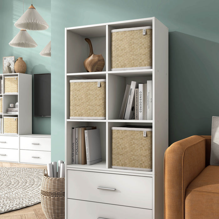 Left facing durable modern six-cubby white storage bookcase as part of a larger modular configuration in a room with accessories