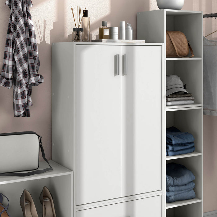 Right facing durable modern two-door white storage cabinet with silver handles as part of a larger modular configuration in a room with accessories