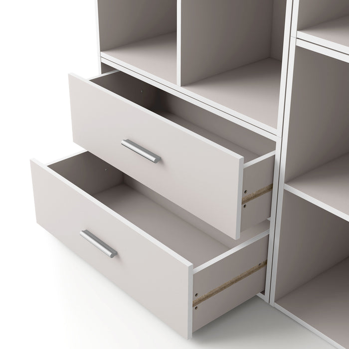 Left facing modern two-drawer taupe grey storage cabinet with silver handles and drawers open in a larger modular bookcase on a white background