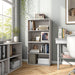 Left facing durable modern two-shelf taupe grey storage bookcase in a larger modular configuration in a room with accessories