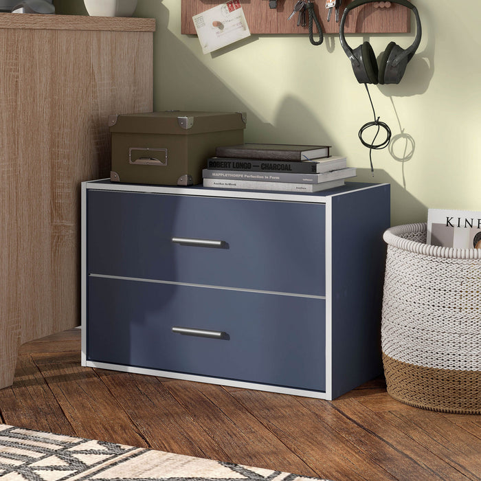 Left facing modern two-drawer steel blue storage cabinet with silver handles in room with accessories