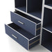 Left facing modern two-drawer steel blue storage cabinet with silver handles and drawers open in a larger modular bookcase on a white background