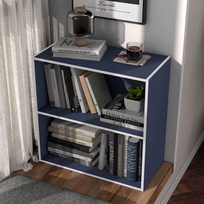 Left facing high-camera view of a durable modern two-shelf steel blue storage bookcase in a larger modular configuration in a room with accessories