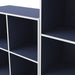 Close up view of a durable modern two-shelf steel blue storage bookcase in a larger modular configuration on a white background