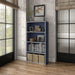 Left facing durable modern four-shelf steel blue storage bookcase in a room with accessories