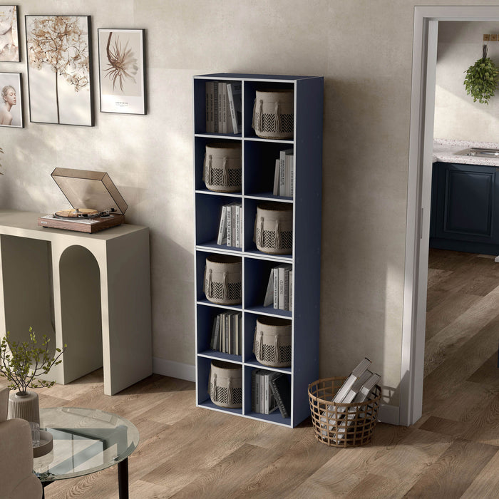 Left facing durable modern six-cubby steel blue storage bookcase as part of a larger modular configuration in a room with accessories