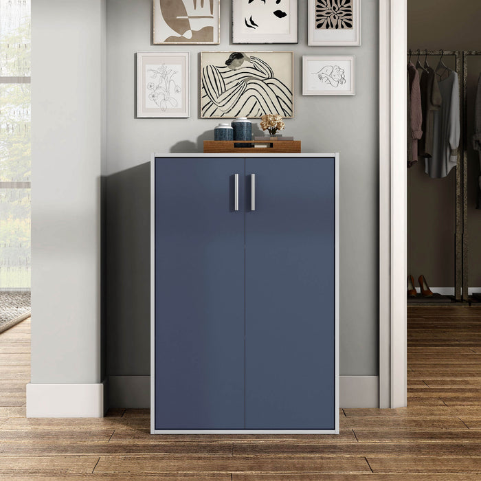 Front facing durable modern two-door steel blue storage cabinet with silver handles in a room with accessories