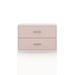 Front facing modern two-drawer light pink storage cabinet with silver handles on a white background