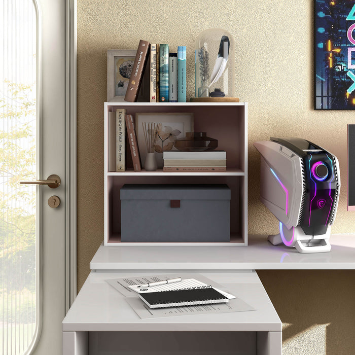 Front facing durable modern two-shelf light pink storage bookcase in a larger modular configuration in a room with accessories