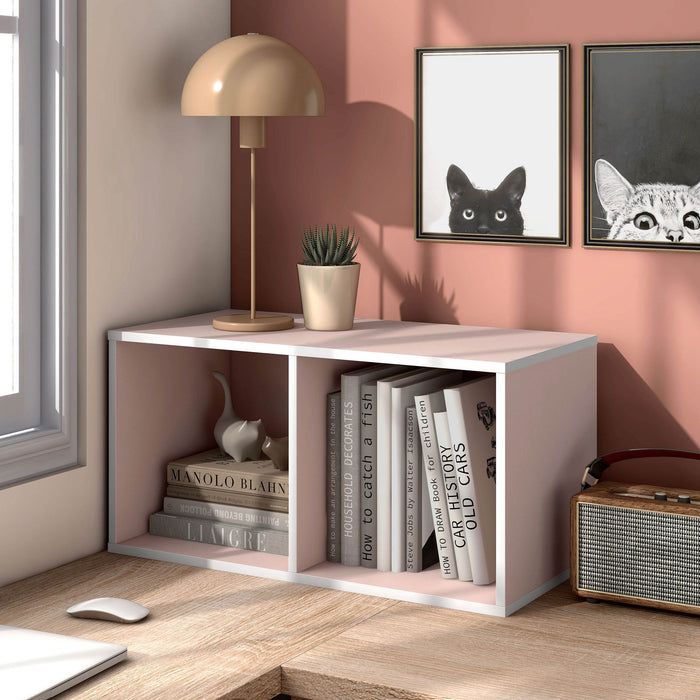 Left facing durable modern two-shelf slim light pink bookcase in a room with accessories