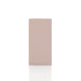 Front facing side view of a durable modern four-cubby light pink storage bookcase on a white background