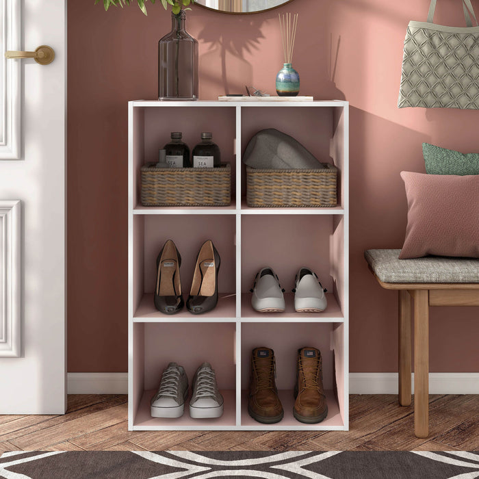 Front facing durable modern six-cubby light pink storage bookcase in a room with accessories