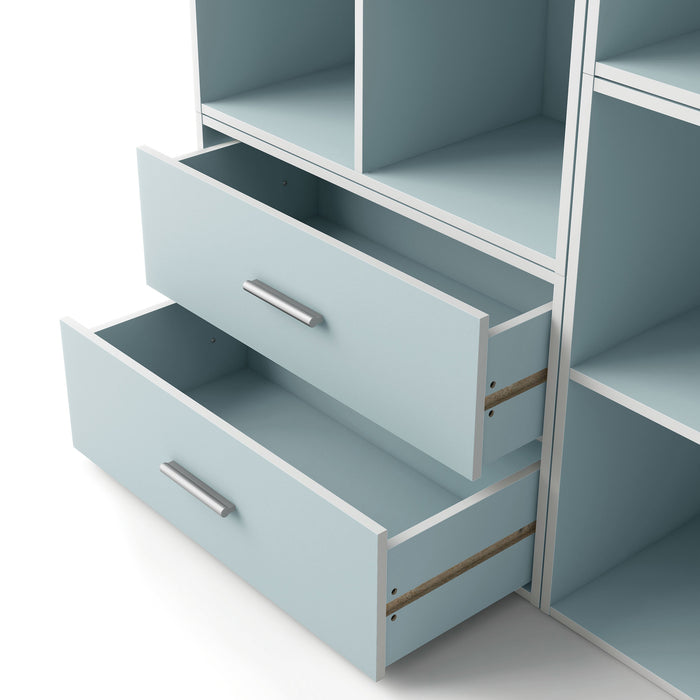 Left facing modern two-drawer light blue storage cabinet with silver handles and drawers open in a larger modular bookcase on a white background