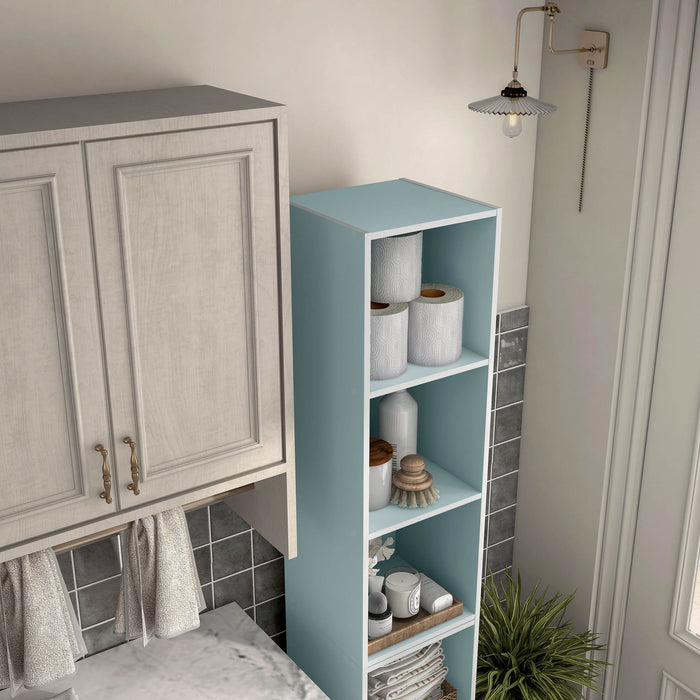 Right facing high-camera view of a durable modern three-shelf slim light blue storage bookcase in a larger modular configuration in a room with accessories