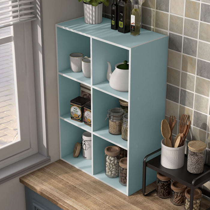 Left facing durable modern six-cubby light blue storage bookcase in a room with accessories