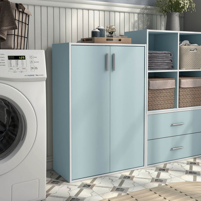 Right facing durable modern two-door light blue storage cabinet with silver handles as part of a larger modular configuration in a room with accessories